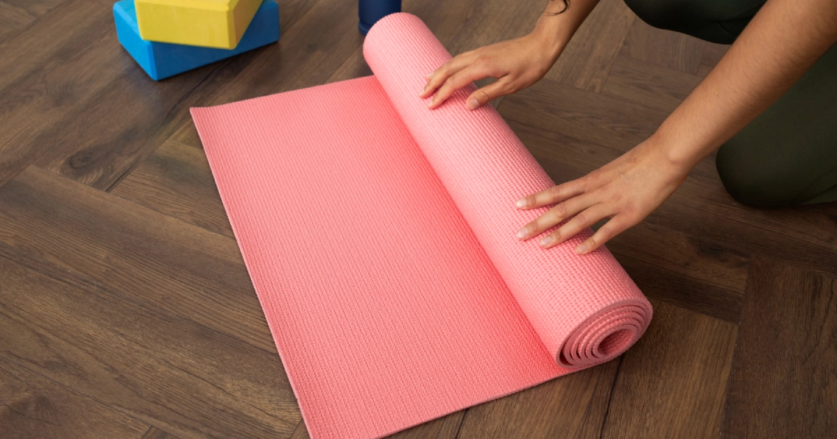 Best yoga mat rolled up and ready for practice with accessories.