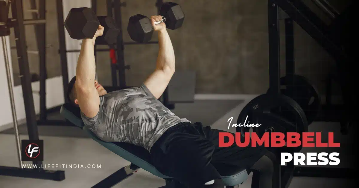 Man performing incline dumbbell press on adjustable bench targeting upper chest muscles at LIFE FIT gym